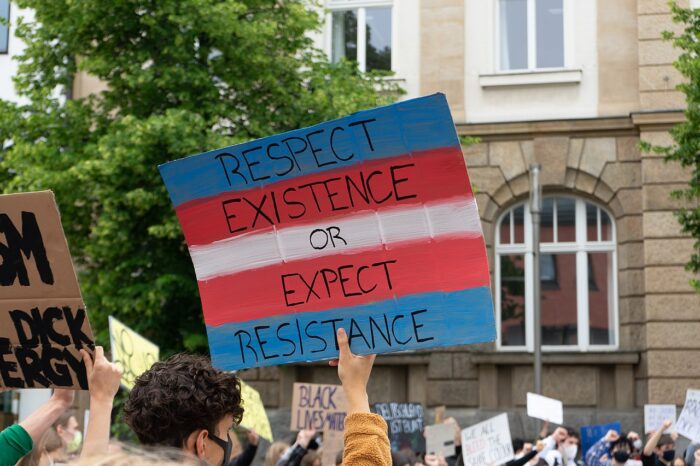 Foto von einem Demo-Schild: Respect Existence or expect resistance