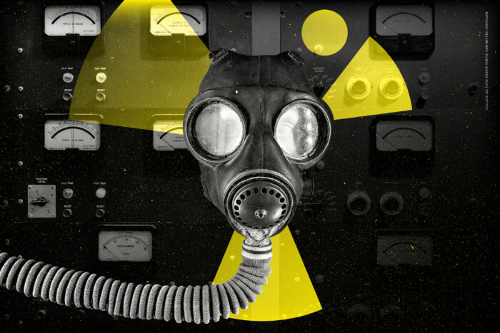 Man sieht eine Atemmaske und ein Atomzeichen.
